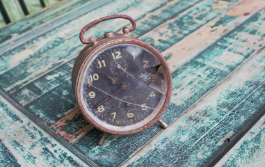Fototapeta na wymiar Vintage old clock on wood wall background.