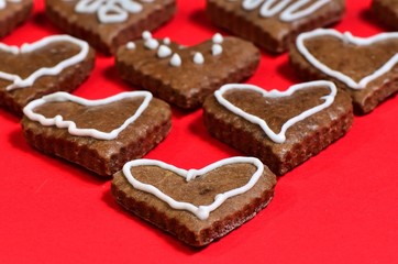 Hearts  /  Hearts on the red background. Focus is on the upper half of the first heart.