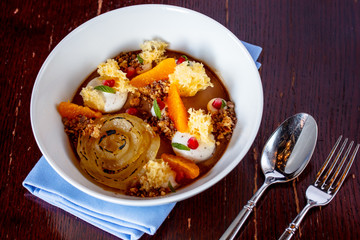 Muesli with chocolate cream, fruits, oranges, sponge cake with p
