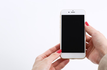 Female hands using white smartphone