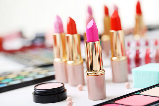 Colourful lipsticks on a white table