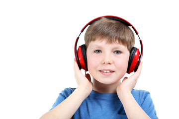 Portrait of young boy with headphones on white background