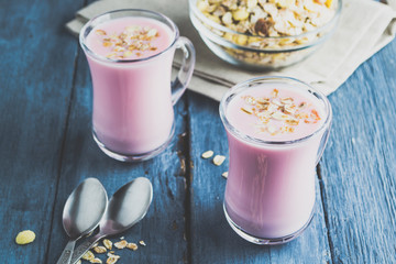 Yoghurt and muesli on a dark blue background