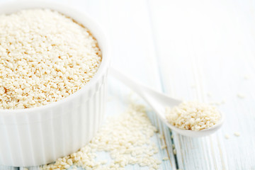 Sesame seeds on a blue wooden table