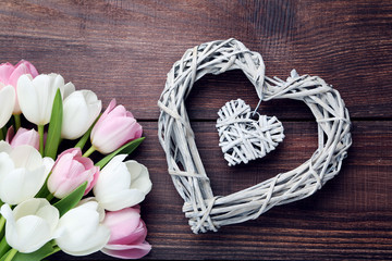 Bouquet of tulips on brown wooden table