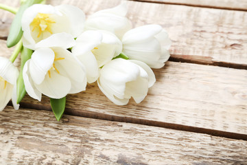 Obraz na płótnie Canvas Bouquet of tulips on grey wooden table