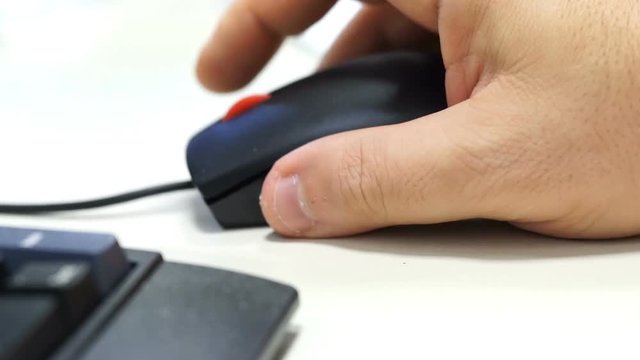 male hand using and click and move the pc mouse