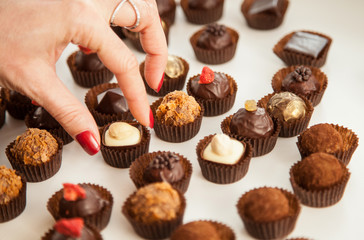Female hand holding a truffle