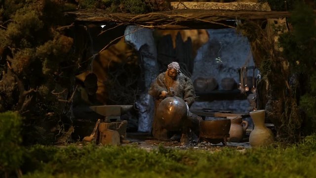 animated statuette of the crib of a old man who delivers the iron of a vase