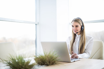 Woman customer support operator with headset and smiling