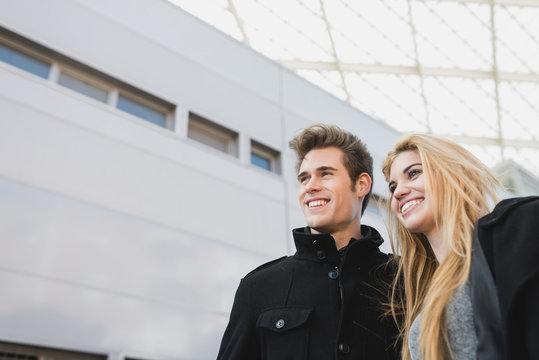 Man And Woman Walking Out Of Office