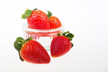 Bright red strawberries against a white background