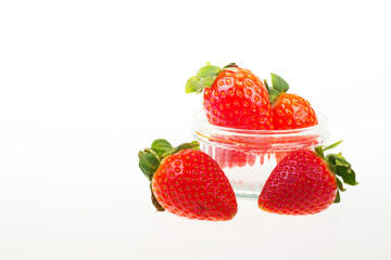 Bright red strawberries against a white background