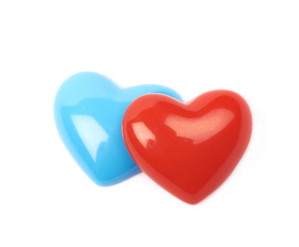 Two glossy heart shaped beads isolated