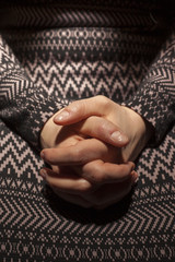 Hands folded to pray