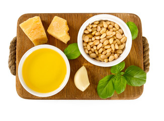 pesto ingredients on wooden surface
