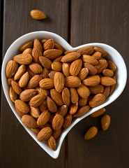 almonds on wooden surface