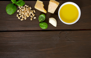 pesto ingredients on wooden surface