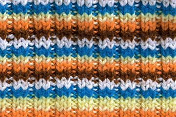 Striped knitting texture, colorful wool fabric background, handmade