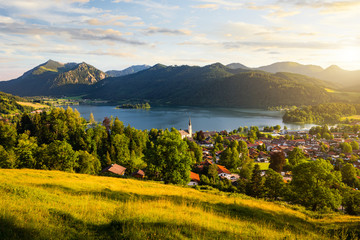 View of mountains and mountain lake during sunset in summer. Beautiful town of Schliersee in...
