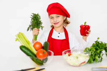 little girl chef is going to prepare a salad isolated