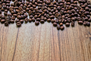 Coffee beans on a wooden table border