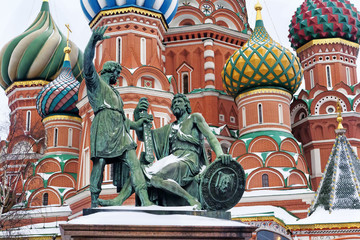 Fototapeta na wymiar Statue of Kuzma Minin and Dmitry Pozharsky and St. Basil's Cathedral detailed on Red Square in Moscow