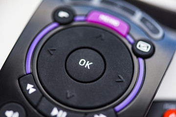 Close-up OK button on the remote tv