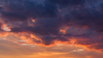 Fiery vivid sunset sky clouds