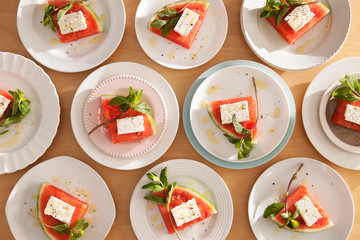Ten plates of Sliced Watermelon with Feta and Mint