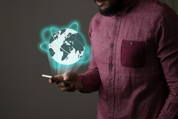 Businessman with smartphone and Global network on screen.