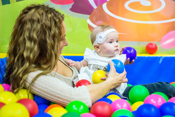 Fototapeta na wymiar mother and child play in the children's room