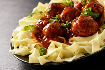 Pasta with turkey meatballs in tomato sauce.