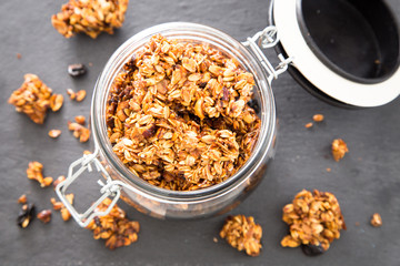 Healthy breakfast. Fresh granola, muesli in a glass jar. 