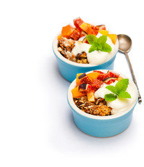 fruit  crumble with oat flakes and persimmon and fig isolated on