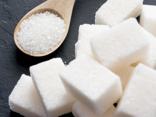 background of white sugar on black