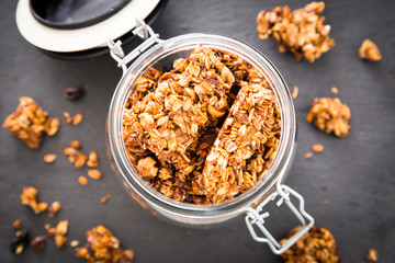 Healthy breakfast. Fresh granola, muesli in a glass jar. 