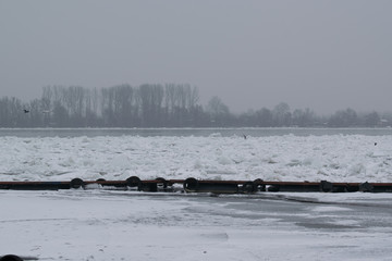 Frozen river with accumulated drift ice putting preasure on dock © bojandimic