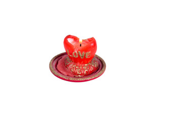 Flame red candles in the shape of a heart with the word love on