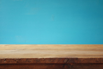 Empty table in front of blue wooden background