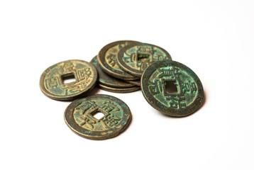 Ancient bronze coins of China on white © zheltobriukh