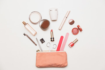 The contents of women's handbags. Make up bag with cosmetics