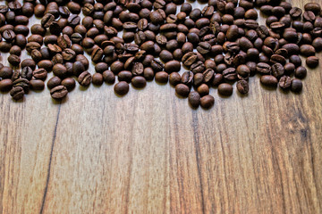 Coffee beans on a wooden table border