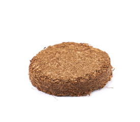 Compressed compost tablet isolated