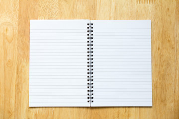 Blank open note book on wooden background 