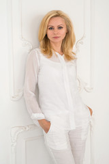 Portrait of a beautiful blonde woman in bright clothing