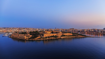 Fototapeta na wymiar Sunrise over Fort Manoel, Malta