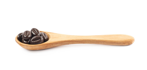 Spoon full of chocolate candies