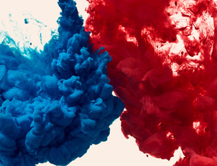 Fototapeta premium Splash of blue and red paint