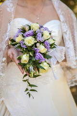the bride holding a bouquet in hands